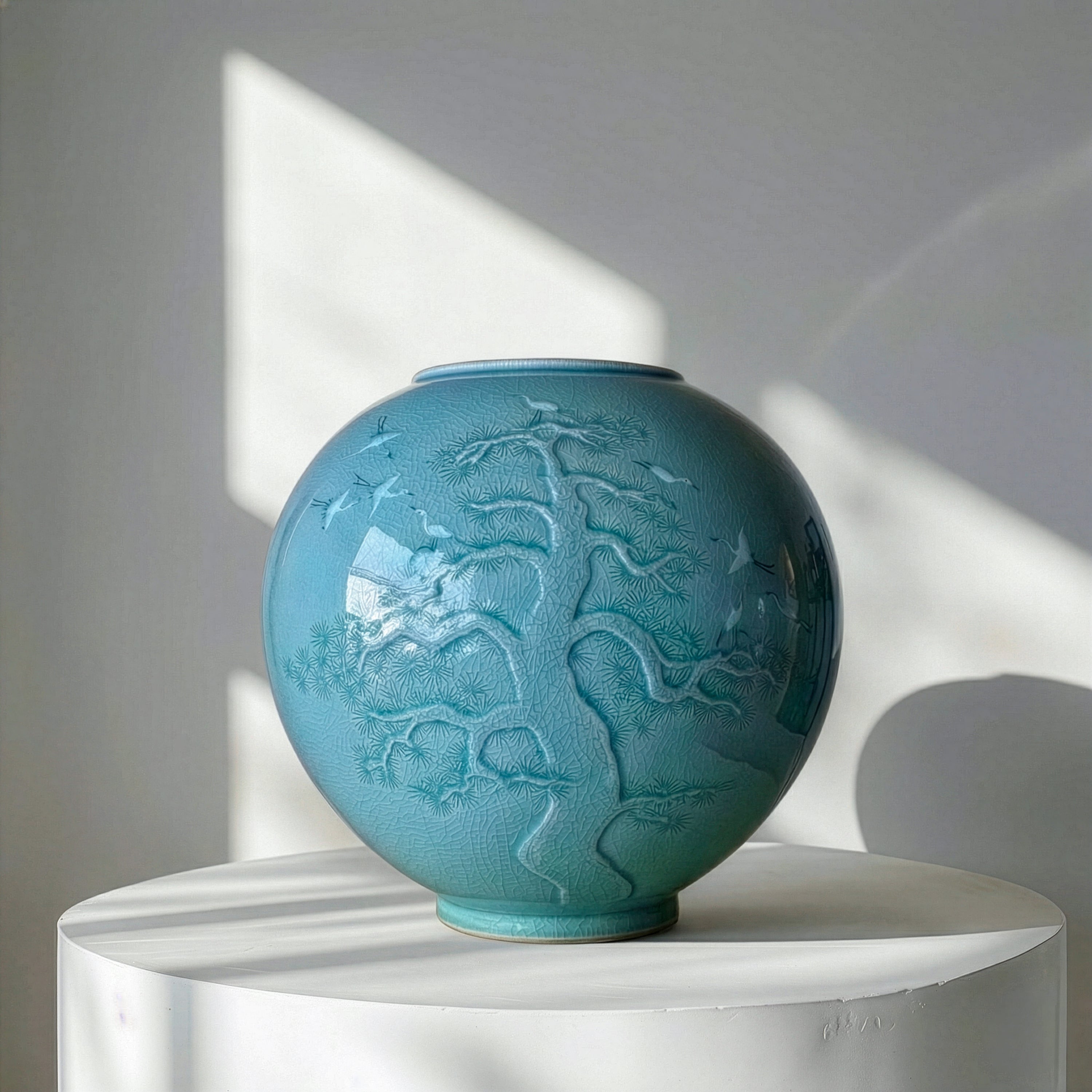 CELADON JAR (HO): PINE IN RELIEF AND INLAID CRANE MOTIF